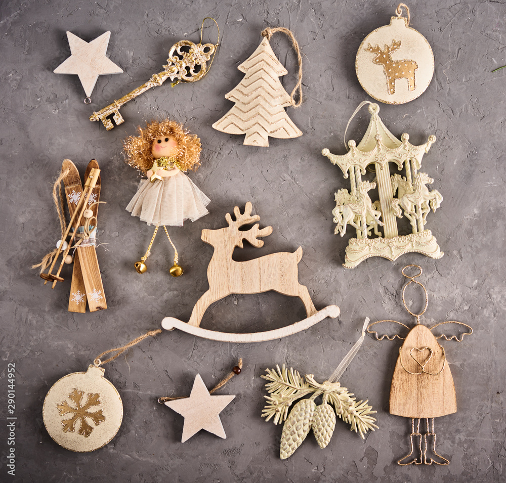 Christmas background. Set with a lot of different baubles and toys over concrete background. Christmas preparation concept Christmas background. Set with a lot of different baubles and toys over concrete background. Christmas preparation concept