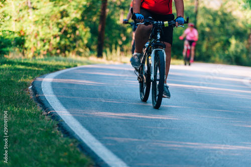 Group of cyclist rides as fast as they can while competing on a cycling marathon.