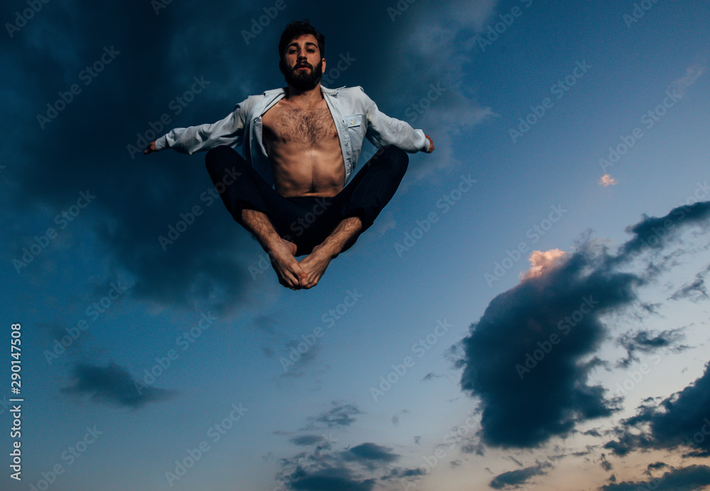 Awesome dancer is jumping very high in the sunset sky Awesome dancer is jumping very high in the sunset sky
