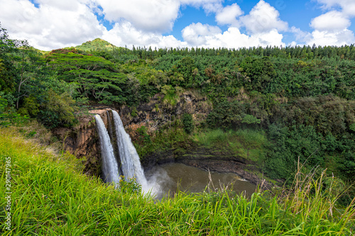 Wailua Falls twin waterfalls in a tropical forest, Kauai, Hawaii, United States