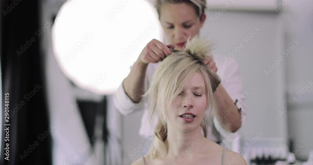 Model having hair styled on a photoshoot Model having hair styled on a photoshoot