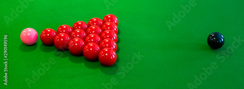 snooker table and red pink and black balls from breakoff time lapse long exposure to show movement on table photo