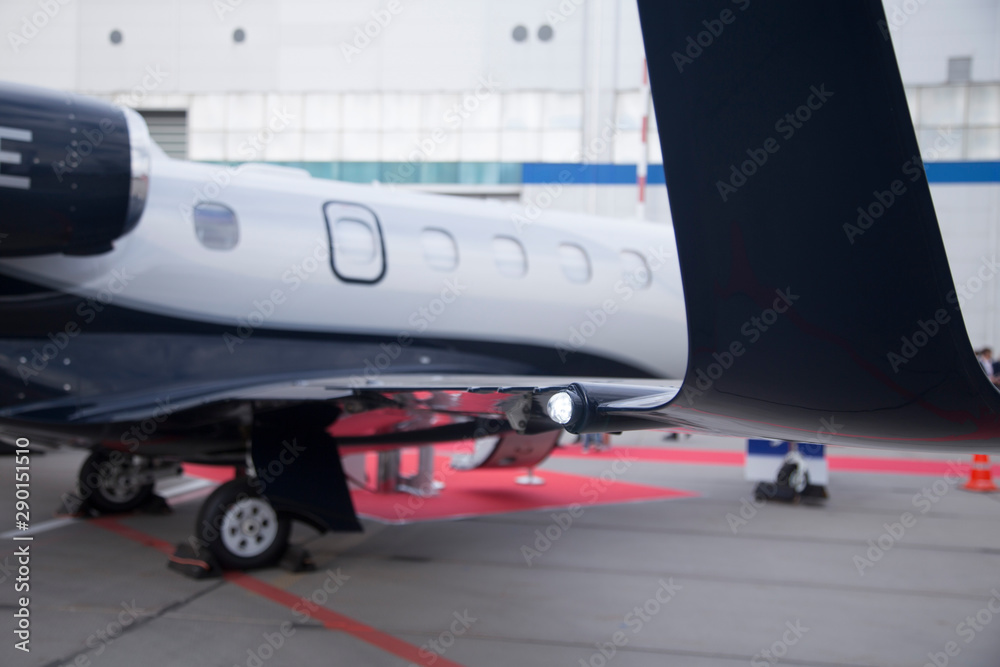 Fototapeta premium navigation light on the wing of jet airplane in airport