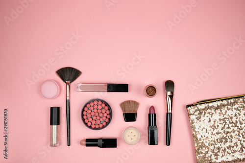 Makeup cosmetic flay lay pink cloral background