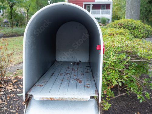 empty mailbox in front of suburban house