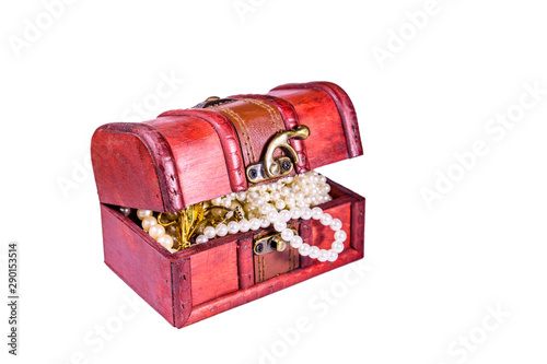 Old box of red wood full of the jewelry isolated on ehite background. Treasure chest