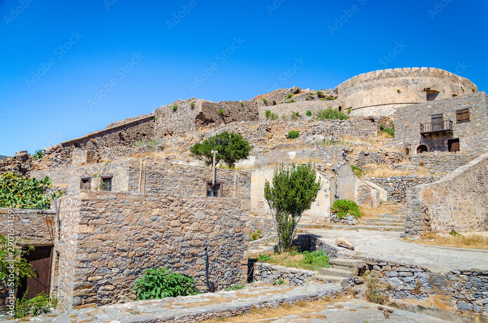The ruins of old buildings in Spinalonga island of lepers in Crete, Greece