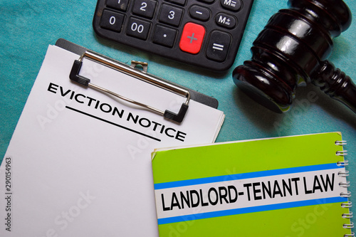 Eviction Notice text on Document form and book Landlord-Tenant Law isolated on office desk. 