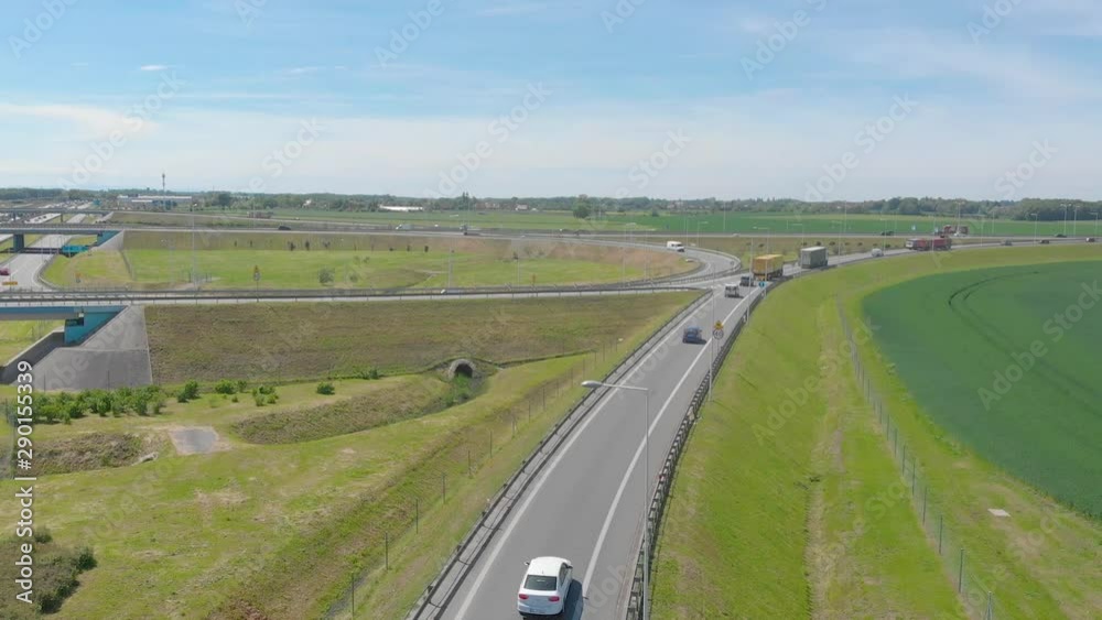 aerial view of highway road interchange with busy traffic (aerial) aerial view of highway road interchange with busy traffic (aerial)