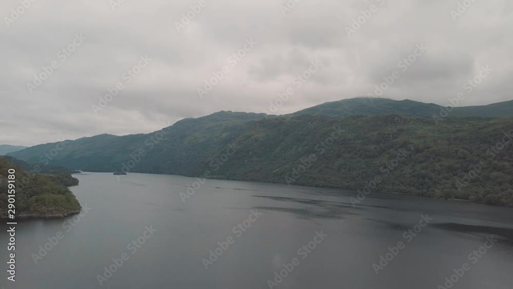 Aerial view of Scottish lake and mountains by a cloudy day