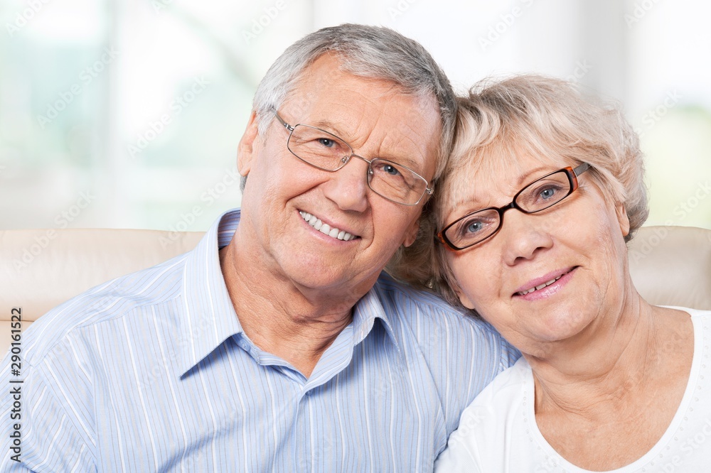 Portrait of happy senior couple smiling at home Portrait of happy senior couple smiling at home