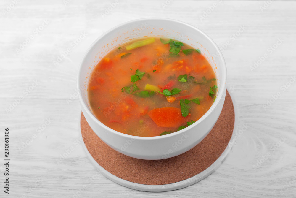 Vegetable soup with sliced carrots, peppers, tomatoes, beans and rice Vegetable soup with sliced carrots, peppers, tomatoes, beans and rice