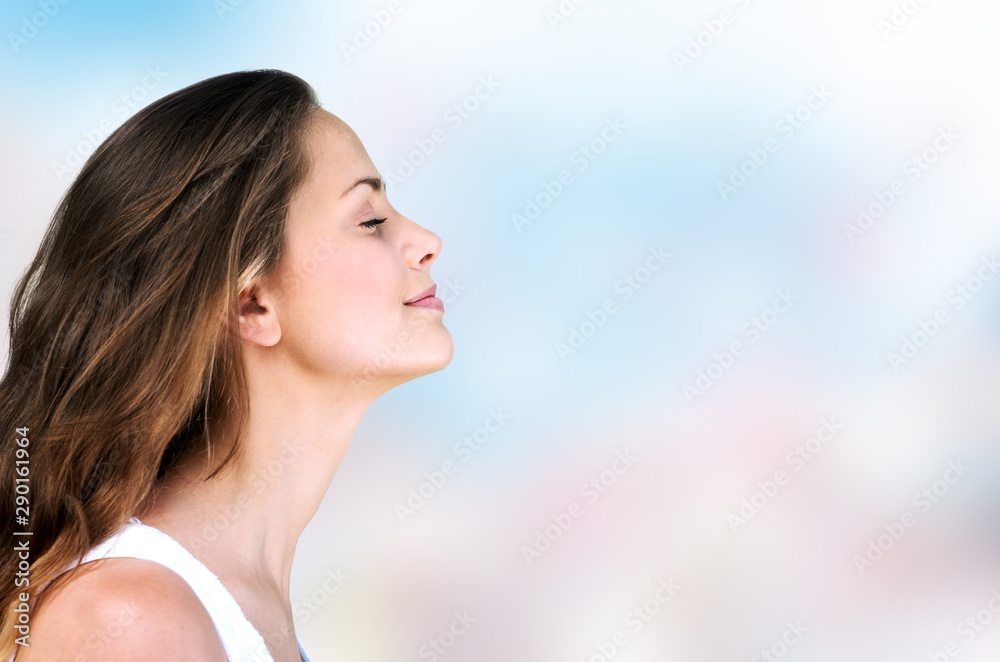 Outdoor summer portrait of pretty young smiling happy woman posing on background Outdoor summer portrait of pretty young smiling happy woman posing on background