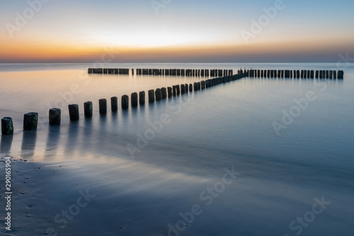 Baltic sea at beautiful sunset in Miedzyzdroje beach. Polish baltic coast. Famous city among the tourist.