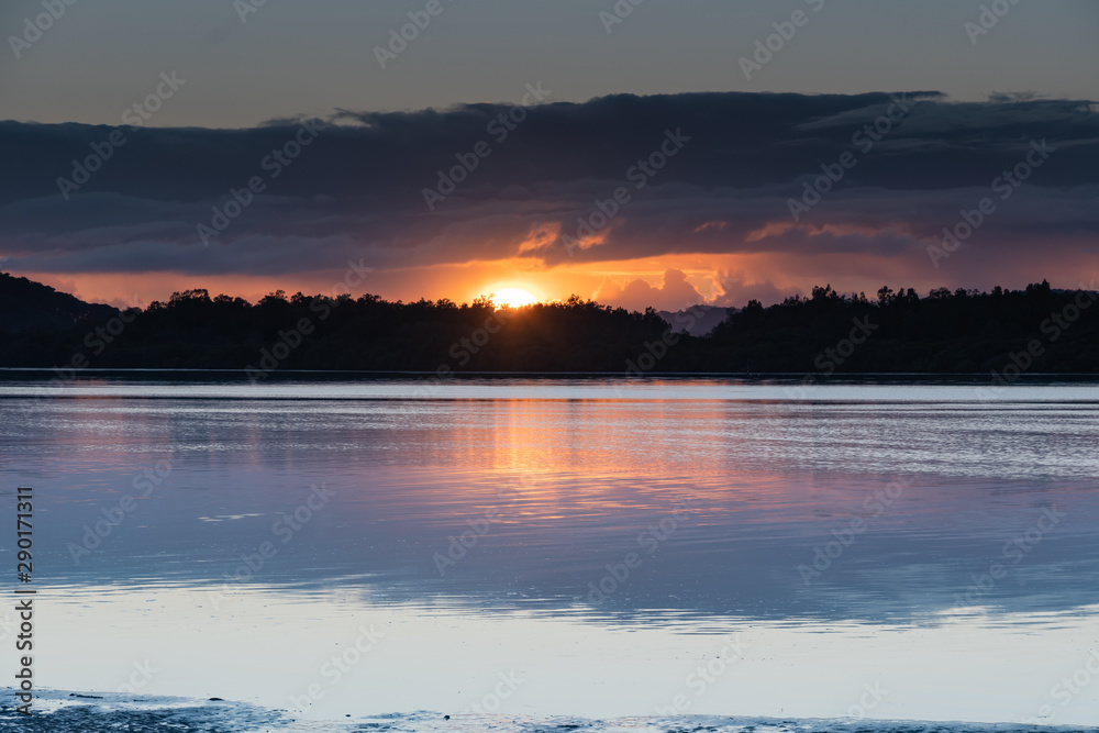 Fototapeta premium Sunrise Waterscape with Low Cloud Bank