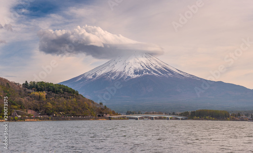 Panoromic view of Fuji mountain with strange clouds covered the summit at lake Kawaguchiko, Japan.