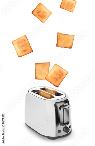 Modern toaster with tasty bread on white background