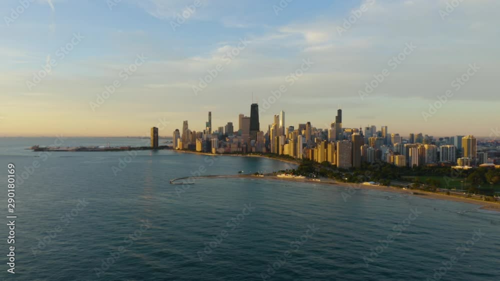 Aerial Push in towards Chicago's skyline during summer sunrise Aerial Push in towards Chicago's skyline during summer sunrise