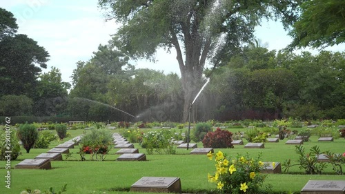 Sprinkler system at Allied War Cemtery, grounds maintenance at Chungkai War Cemetery, Kanchanaburi, Thailand.1080. photo