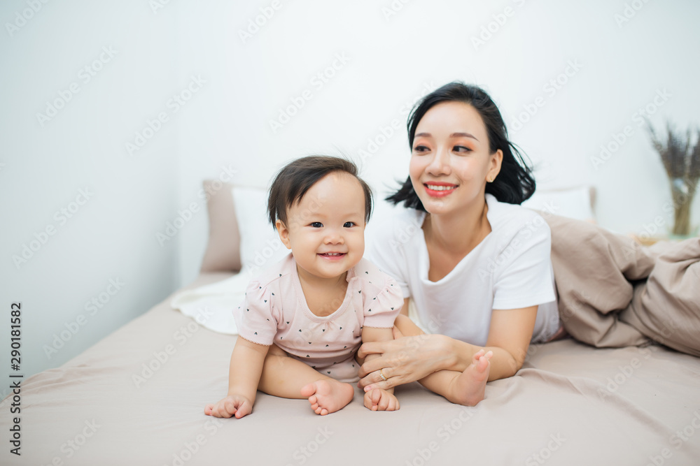 Beatuful mother playing with daughter. Little girl have fun at home. Beatuful mother playing with daughter. Little girl have fun at home.