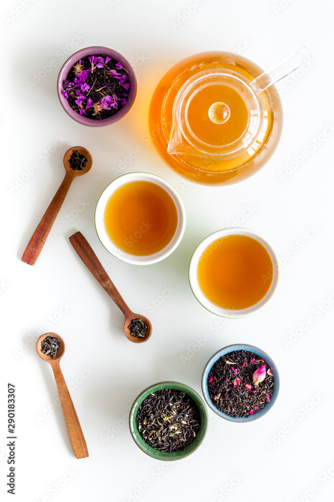 Tea ceremony with leaves and brew on white background top view Tea ceremony with leaves and brew on white background top view