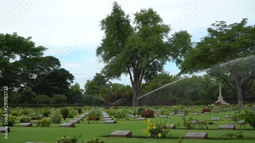 Sprinkler system at Allied War Cemtery, grounds maintenance at Chungkai War Cemetery, Kanchanaburi, Thailand. 4K. photo