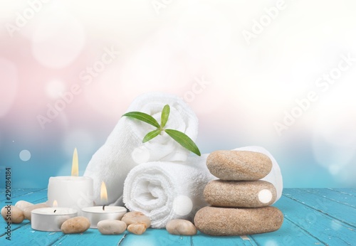 Spa concept with zen basalt stones and towels