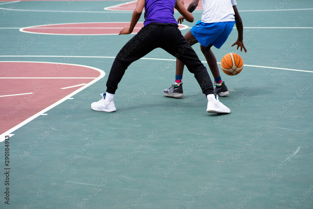 Two young boys playing a one on one match