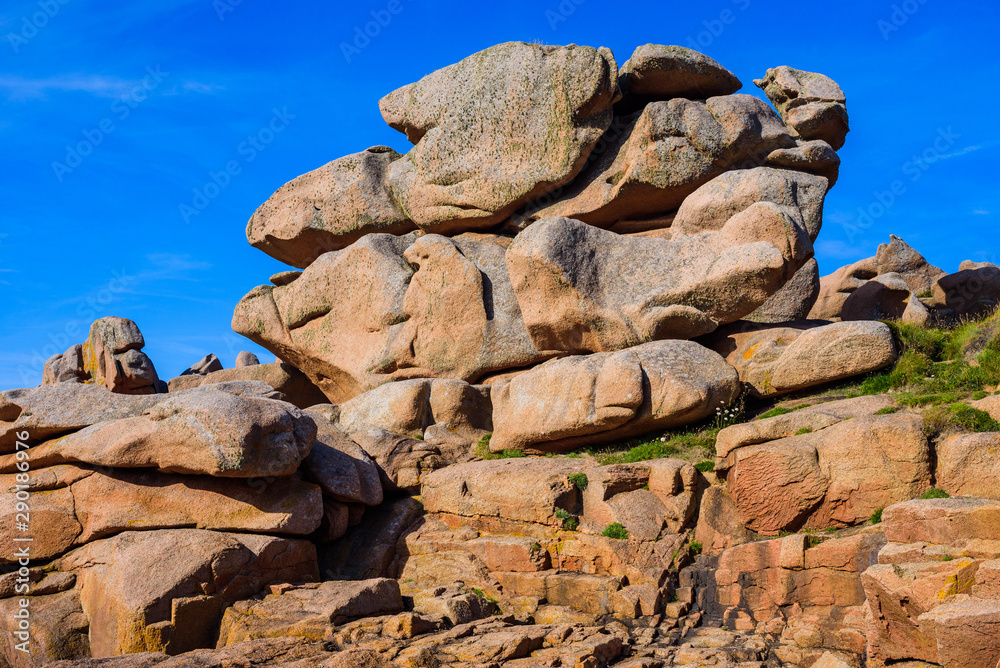 Granite pink boulders near Plumanach. The coast of Pink Granite is a unique place in Brittany. France Granite pink boulders near Plumanach. The coast of Pink Granite is a unique place in Brittany. France