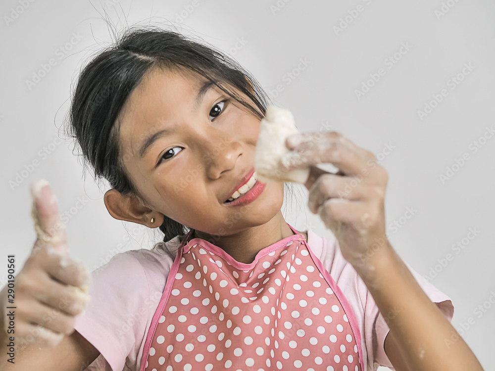 Asian girl holding dough for making bread or pizza, lifestyle concept. Asian girl holding dough for making bread or pizza, lifestyle concept.