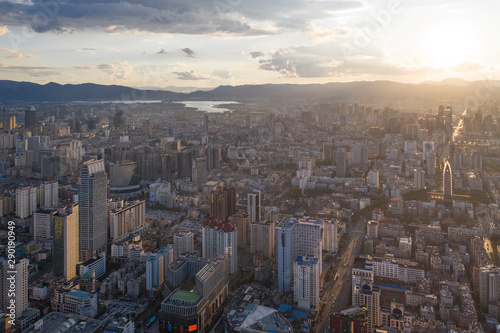 Kunming  China - September 13  2019  Aerial view of Kunming at sunset with the Dianchi lake on background