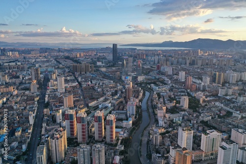 Kunming  China - September 13  2019  Aerial view of Kunming at sunset with the Dianchi lake on background