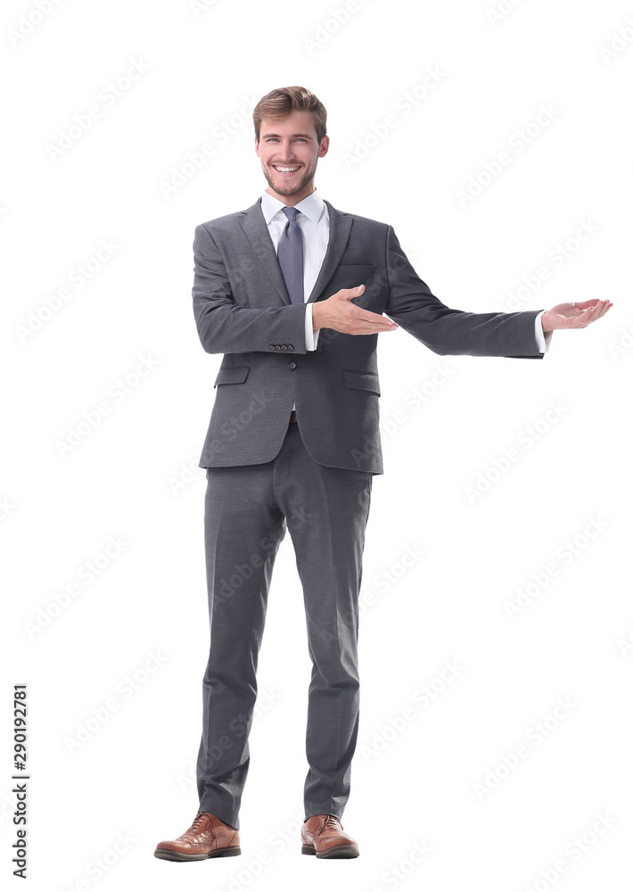 in full growth. businessman with a hand in a welcoming gesture. in full growth. businessman with a hand in a welcoming gesture.