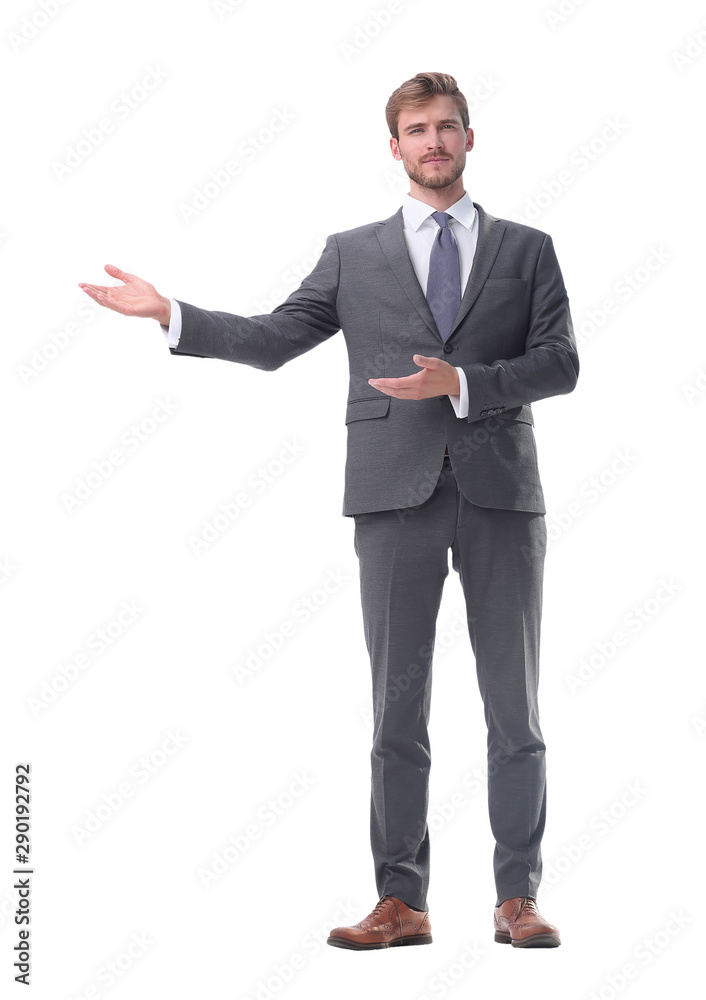 in full growth. businessman with a hand in a welcoming gesture. in full growth. businessman with a hand in a welcoming gesture.