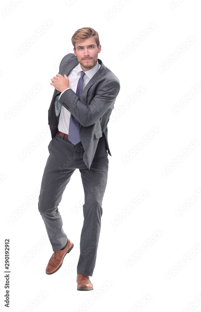 in full growth. determined young businessman goes forward. in full growth. determined young businessman goes forward.