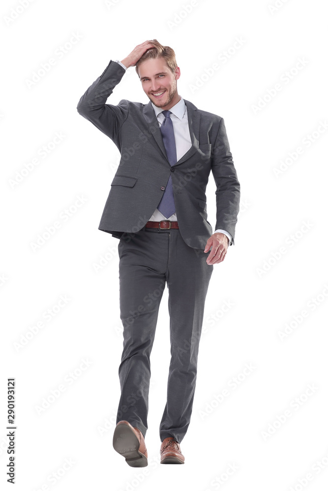 smiling young business man confidently goes forward