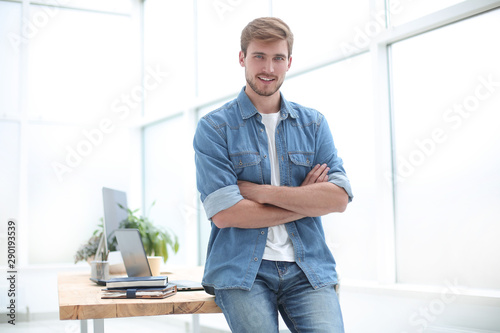 successful young entrepreneur standing in the office