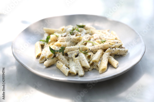 Penne pasta with white sauce and truffle , italian food