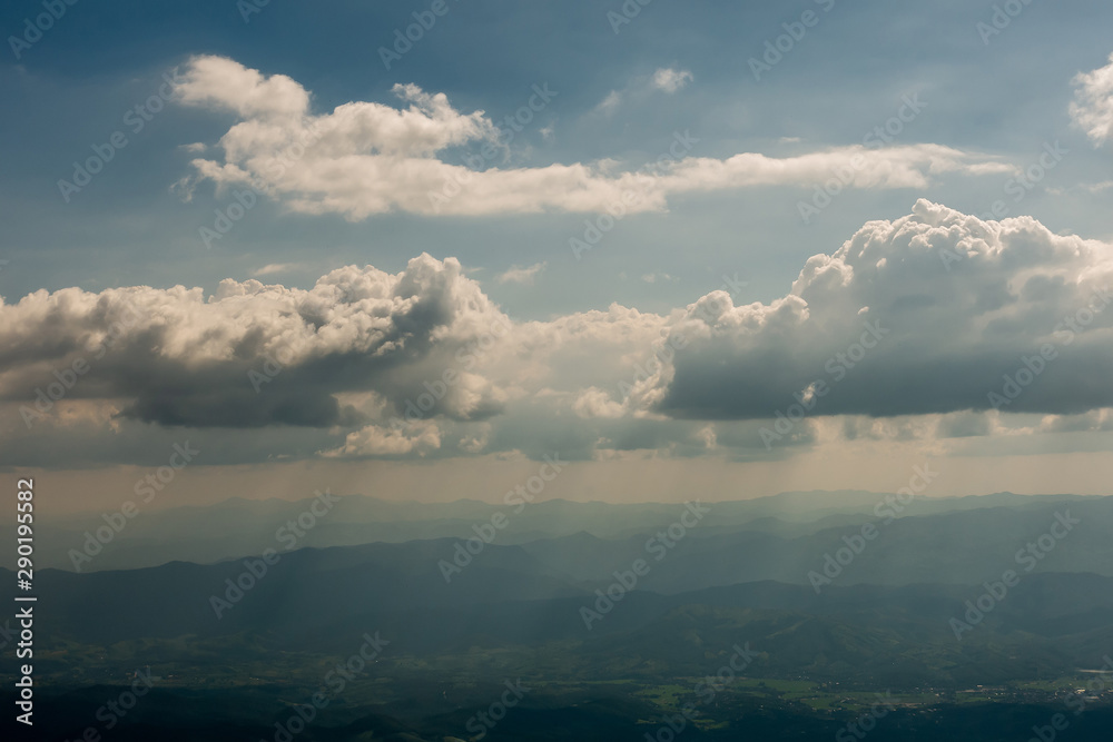 The mountains and forests with blue sky and white clouds at the peak of Inthanon national park (park name) in Chiang Mai province , Thailand in a cloudy and sunny day.