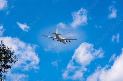 huge cargo transport plane takes off in the sky