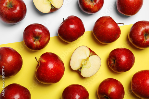 Flat lay composition with ripe juicy red apples on color background