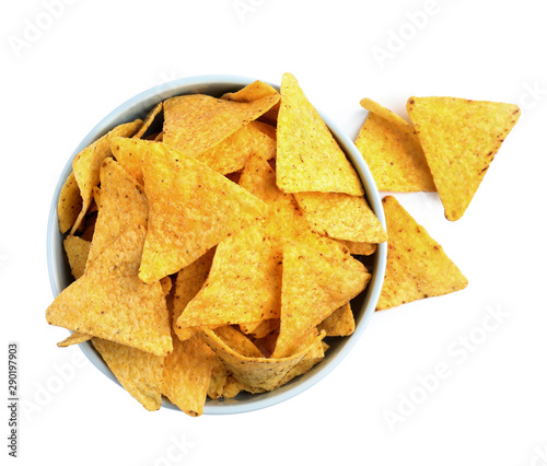 Bowl with tasty Mexican nachos chips on white background, top view