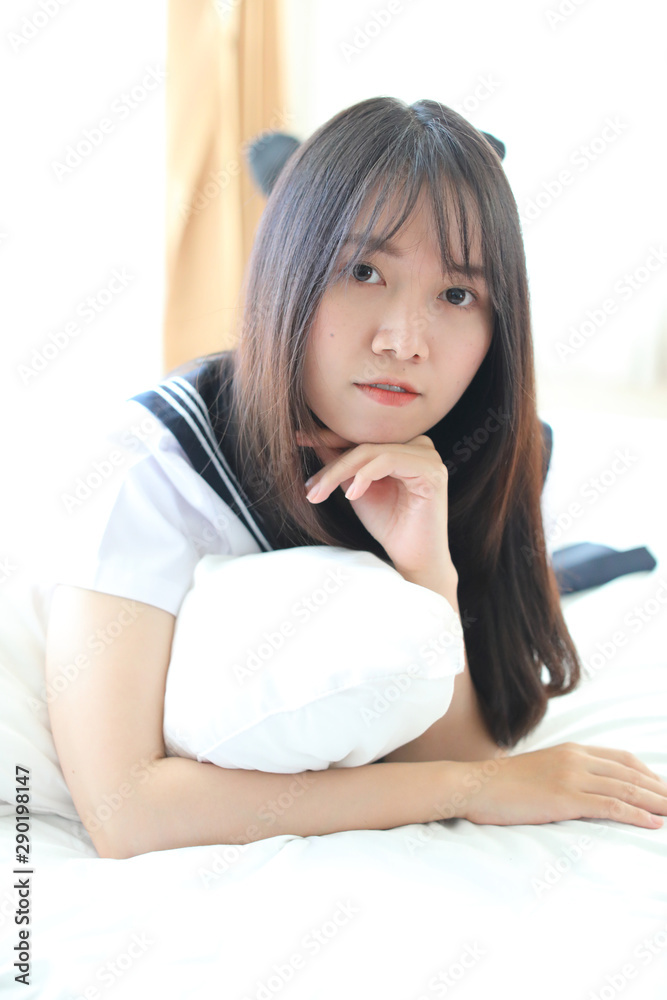 Portrait japanese school girl in white tone bed room Portrait japanese school girl in white tone bed room