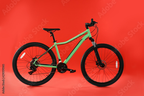 Modern bicycle on red background. Healthy lifestyle