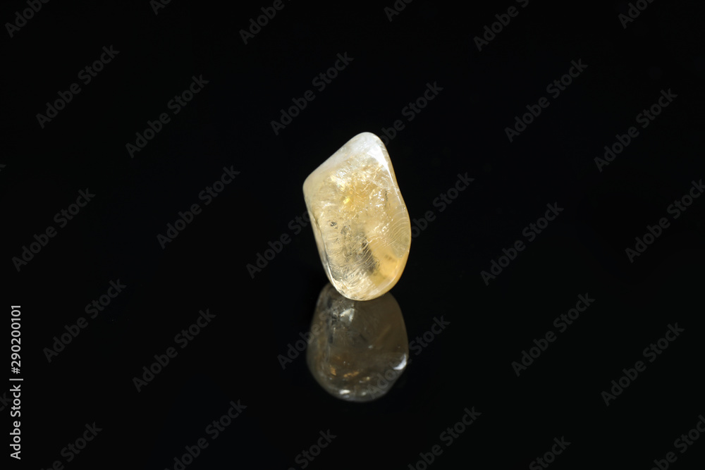 Beautiful citrine quartz gemstone on black background Beautiful citrine quartz gemstone on black background