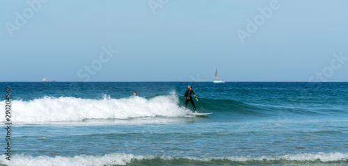 teenager surfing on the west coast of Brittany in France at Toulinguet Beach near Camaret-Sur-Mer