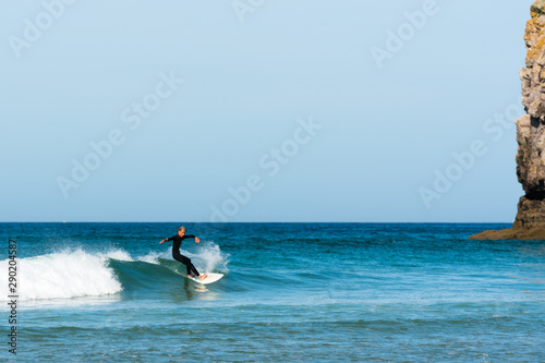 teenager surfing on the west coast of Brittany in France at Toulinguet Beach near Camaret-Sur-Mer