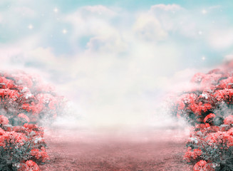 Fantasy summer photo background with roses flowers field and misty path leading to fairytale glade. Idyllic tranquil morning scene, road goes across hills, empty copy space. Toned in pastel colors.