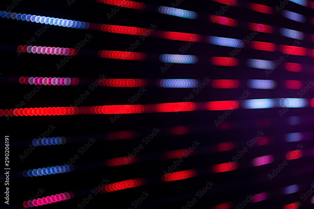 Abstract beautiful blurred or soft bokeh of LED lighting. Group of blurry multi color ornamental lights flickering. Background for digital data transformation or energy saving or stock market concept.