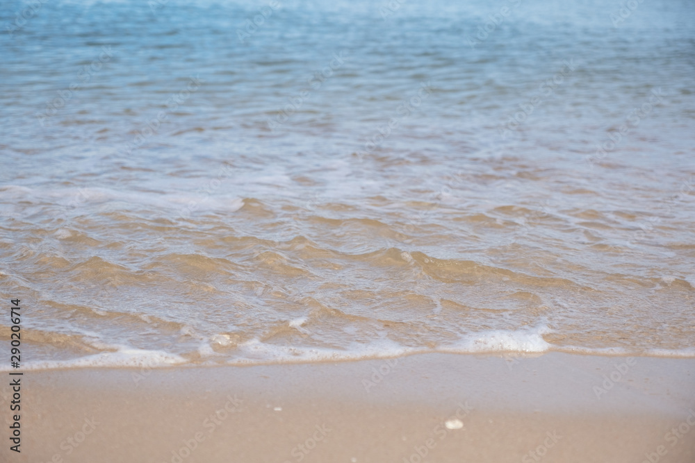 Landscape image of tropical white beach with blue sea and sky background